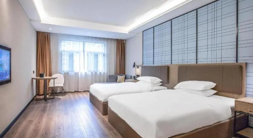 Bed in Echarm Hotel Changsha Yueliangdao Guanziling Metro Station