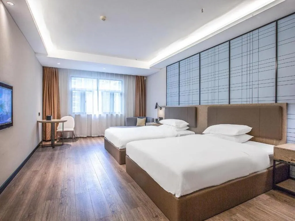 Bed in Echarm Hotel Changsha Yueliangdao Guanziling Metro Station