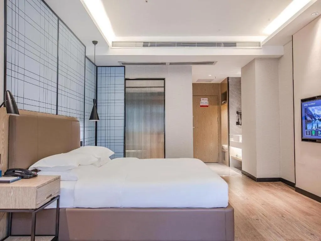 Bed in Echarm Hotel Changsha Yueliangdao Guanziling Metro Station