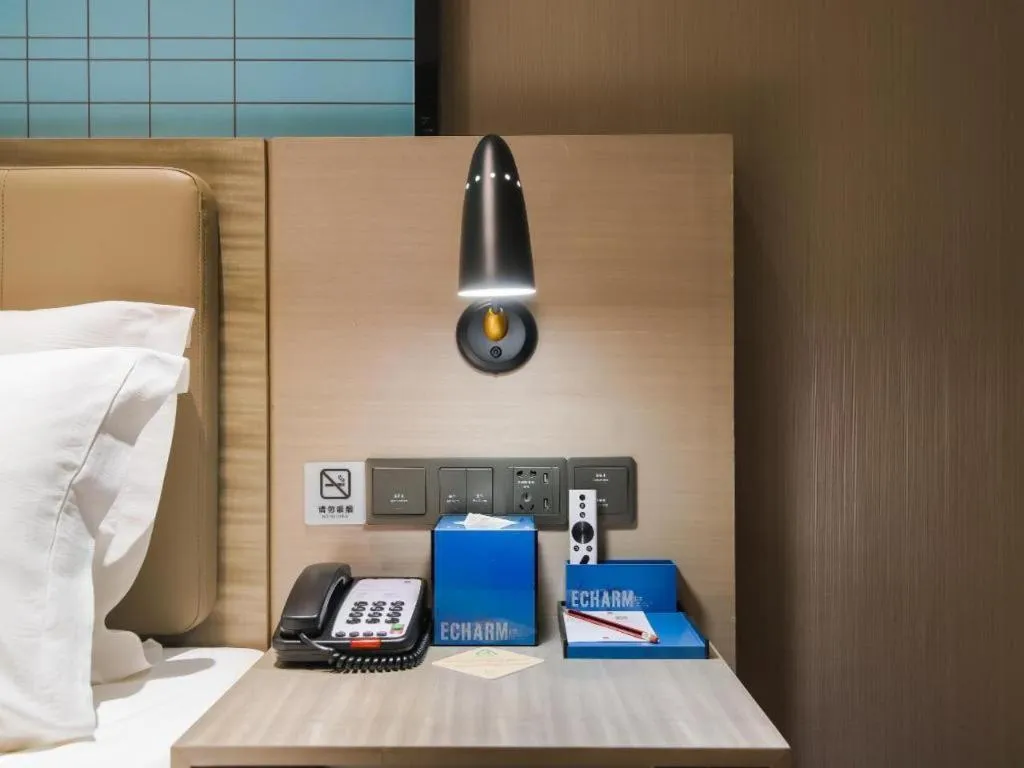 Bed in Echarm Hotel Changsha Yueliangdao Guanziling Metro Station