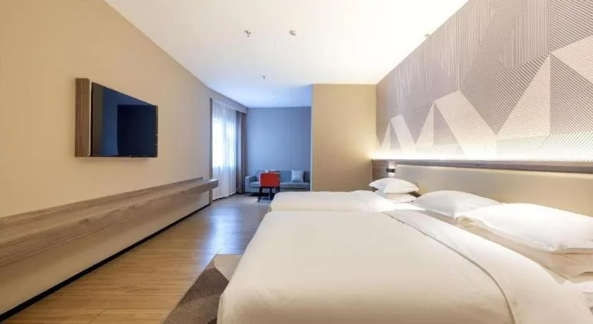 Bed in Borrman Hotel Korla Peacock River