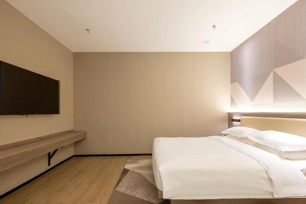 Bed in Borrman Hotel Korla Peacock River