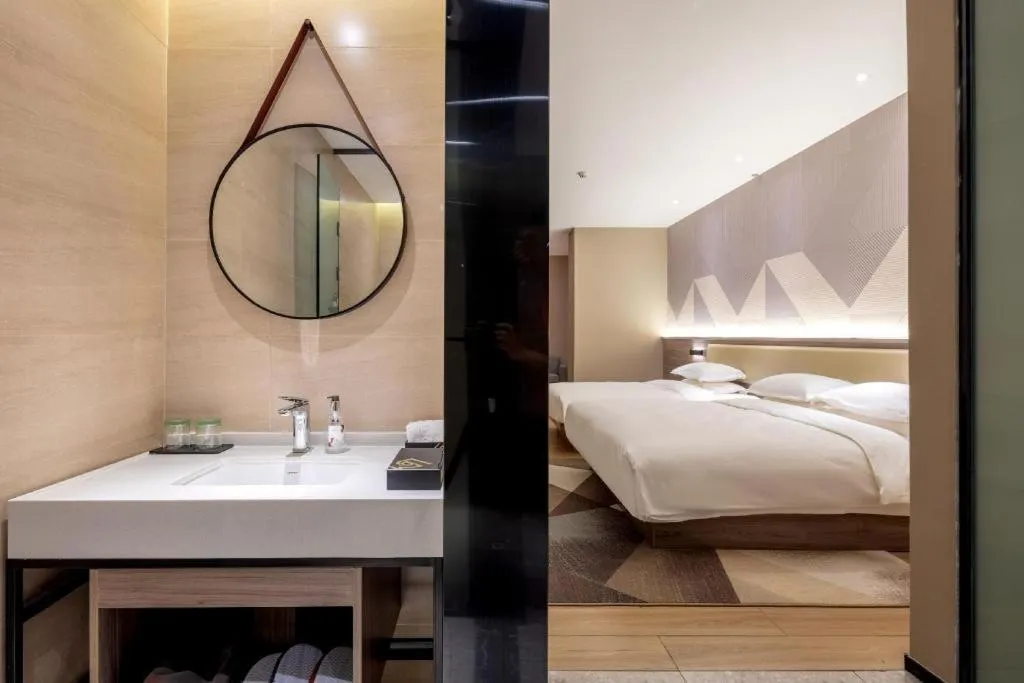 Bed in Borrman Hotel Korla Peacock River