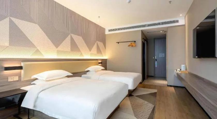 Bed in Borrman Hotel Korla Peacock River