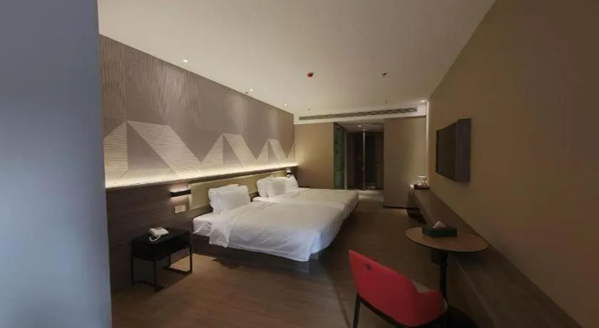 Bed in Borrman Hotel Korla Peacock River