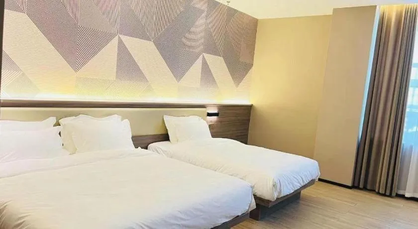 Bed in Borrman Hotel Korla Peacock River