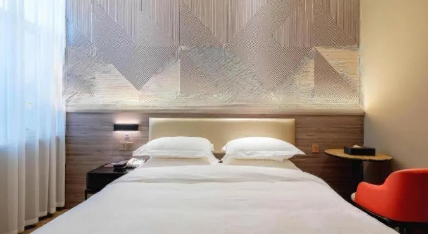 Bed in Borrman Hotel Korla Peacock River