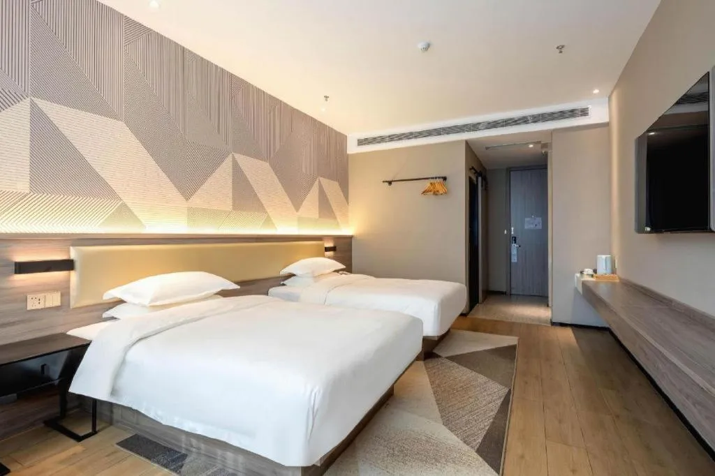 Bed in Borrman Hotel Korla Peacock River