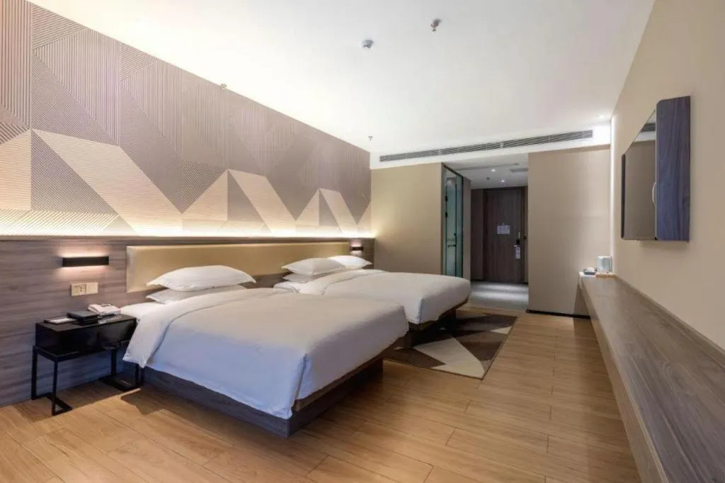 Bed in Borrman Hotel Korla Peacock River