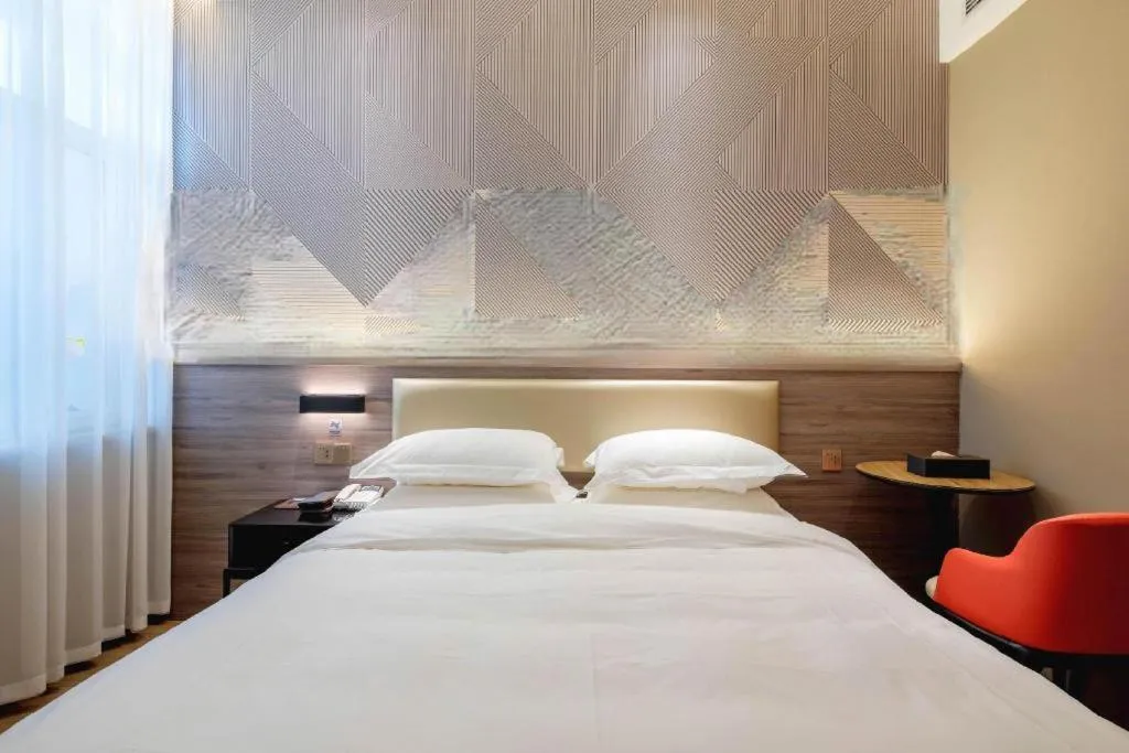 Bed in Borrman Hotel Korla Peacock River