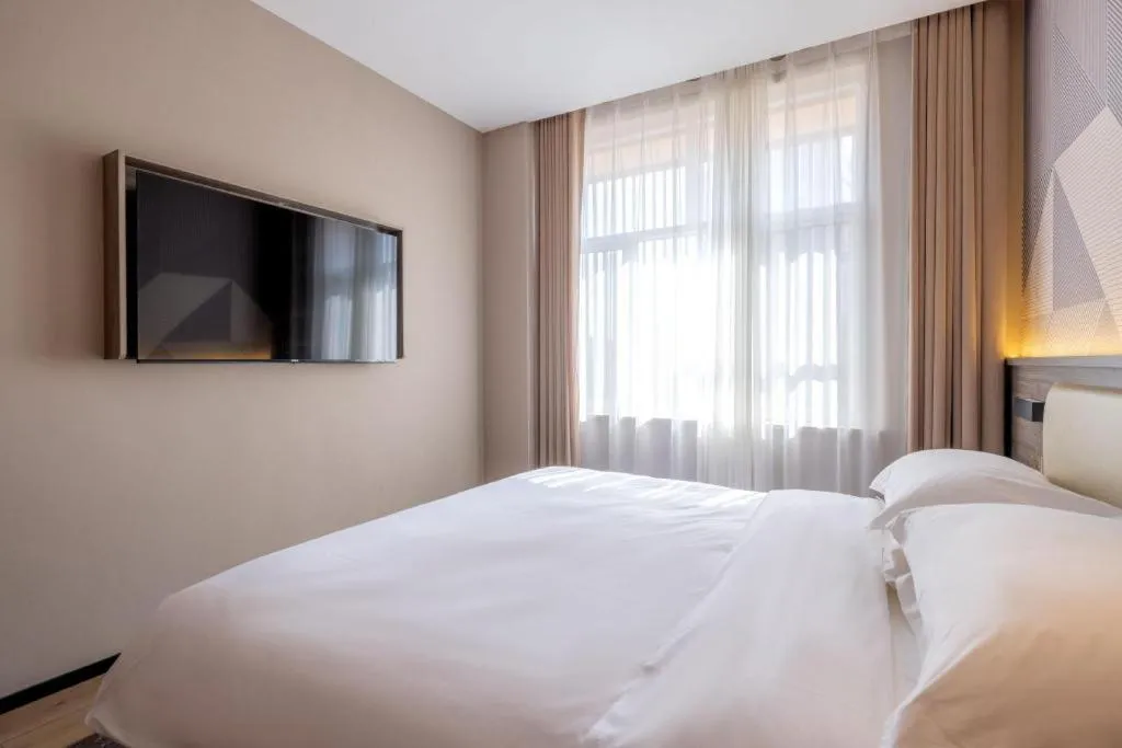 Bed in Borrman Hotel Korla Peacock River