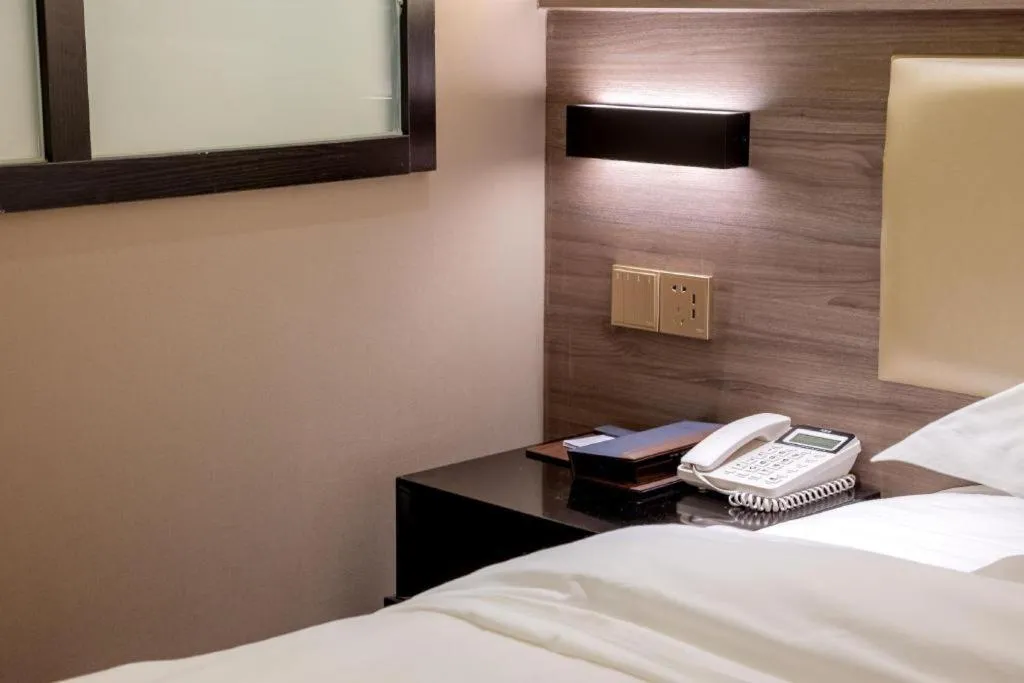 Bed in Borrman Hotel Korla Peacock River