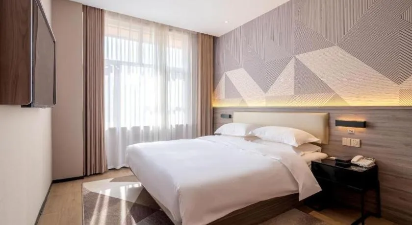 Bed in Borrman Hotel Korla Peacock River