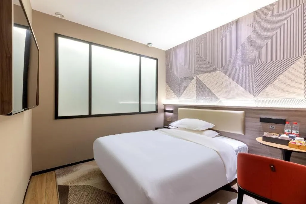 Bed in Borrman Hotel Korla Peacock River