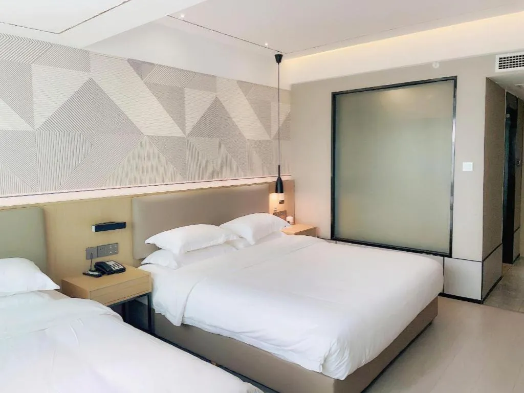 Bed in Borrman Hotel Wanning Wenming Road High-speed Railway Station