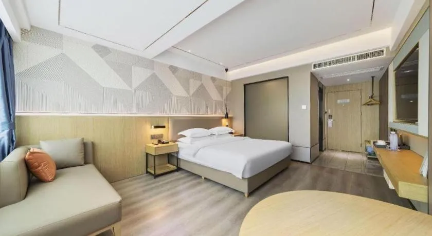 Bed in Borrman Hotel Wanning Wenming Road High-speed Railway Station