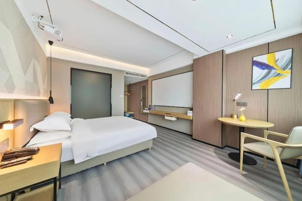 Bed in Borrman Hotel Wanning Wenming Road High-speed Railway Station