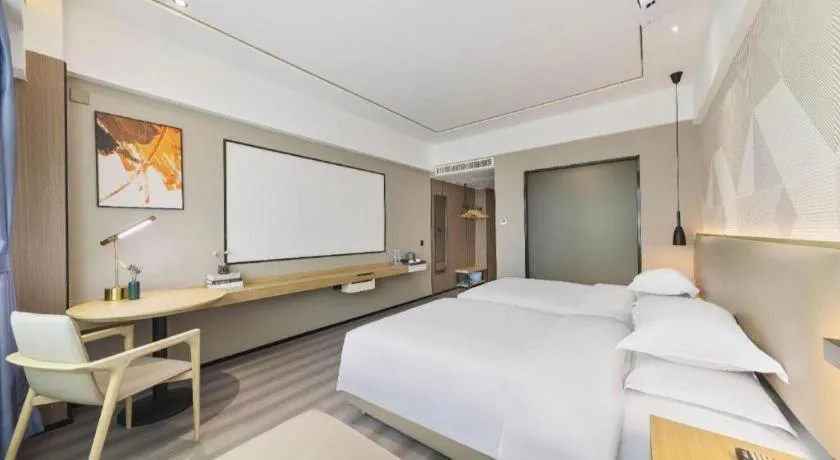 Bed in Borrman Hotel Wanning Wenming Road High-speed Railway Station