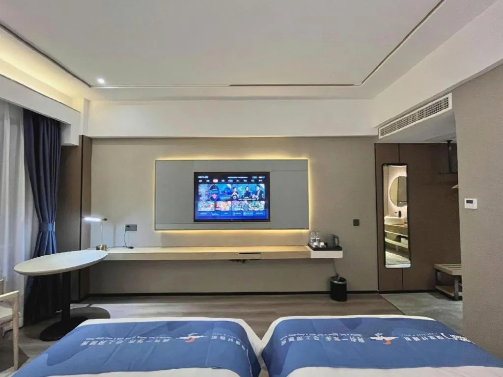 Bed in Borrman Hotel Wanning Wenming Road High-speed Railway Station