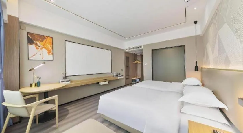 Bed in Borrman Hotel Wanning Wenming Road High-speed Railway Station