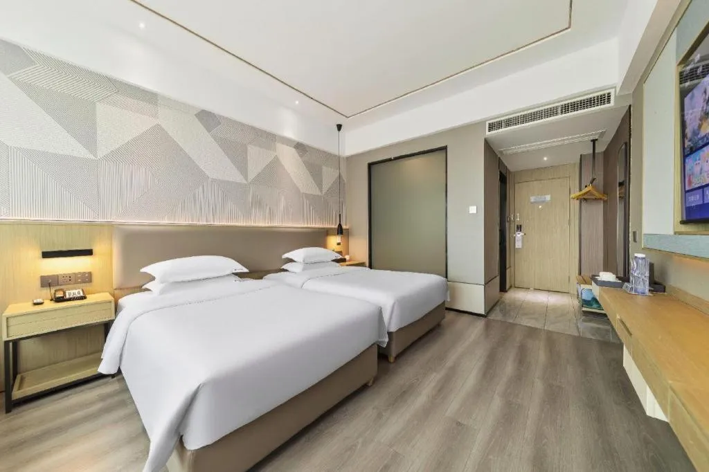 Bed in Borrman Hotel Wanning Wenming Road High-speed Railway Station