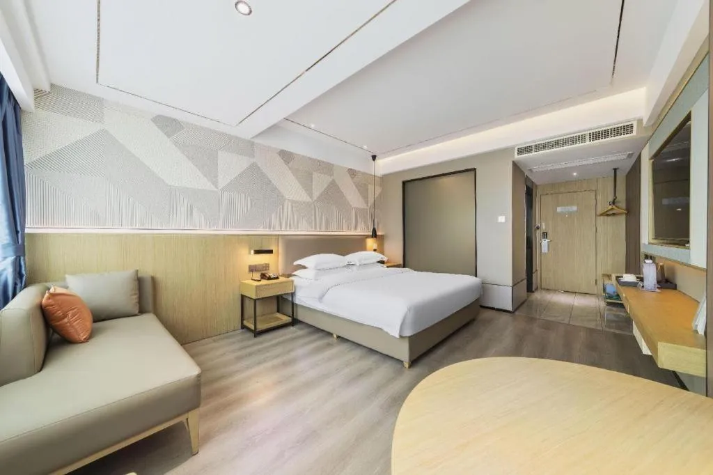 Bed in Borrman Hotel Wanning Wenming Road High-speed Railway Station