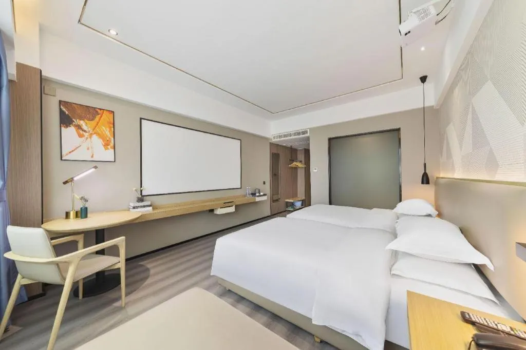 Bed in Borrman Hotel Wanning Wenming Road High-speed Railway Station