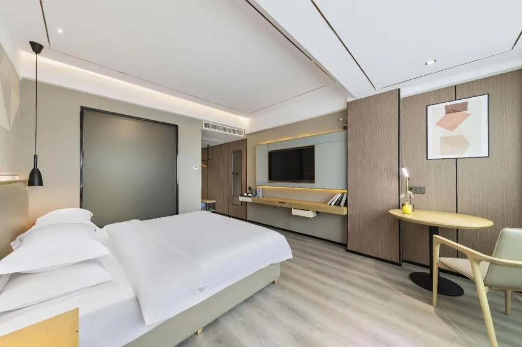 Bed in Borrman Hotel Wanning Wenming Road High-speed Railway Station