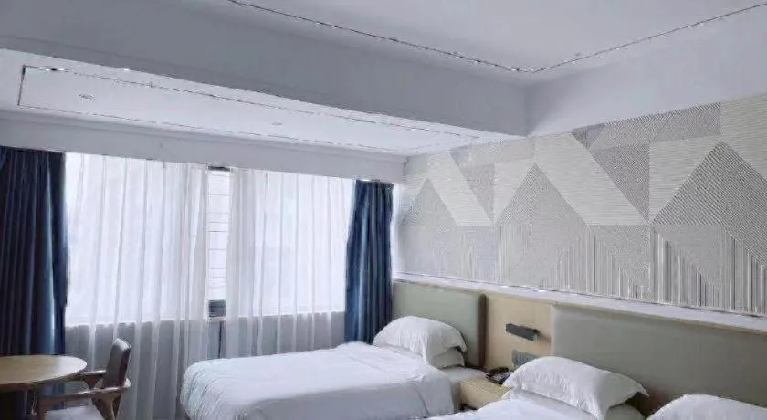 Bed in Borrman Hotel Wanning Wenming Road High-speed Railway Station