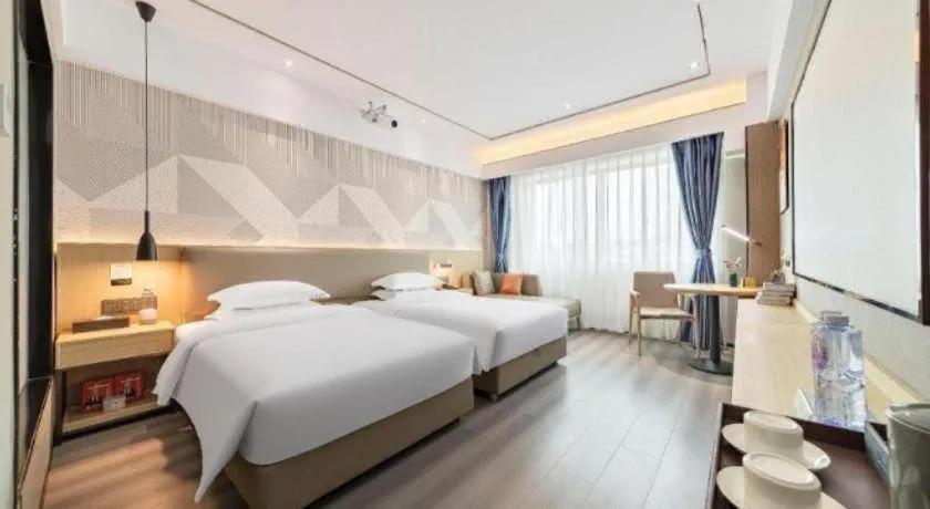 Bed in Borrman Hotel Wanning Wenming Road High-speed Railway Station