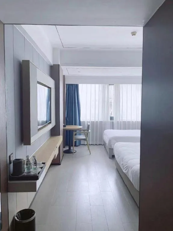 Bed in Borrman Hotel Wanning Wenming Road High-speed Railway Station