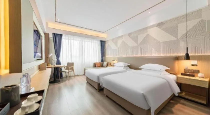 Bed in Borrman Hotel Wanning Wenming Road High-speed Railway Station