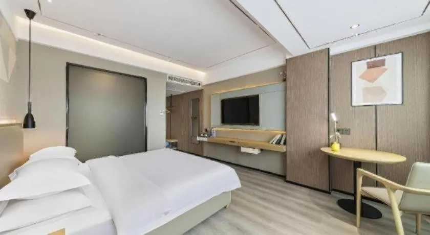 Bed in Borrman Hotel Wanning Wenming Road High-speed Railway Station