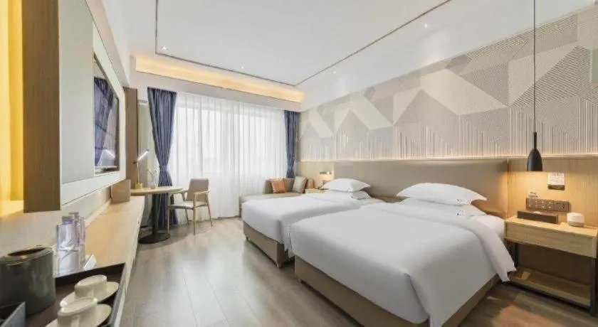 Bed in Borrman Hotel Wanning Wenming Road High-speed Railway Station