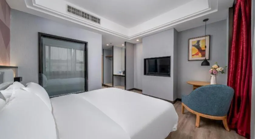 Bed in Borrman Hotel Guangzhou Xinshi Baixin Plaza Qifu Road