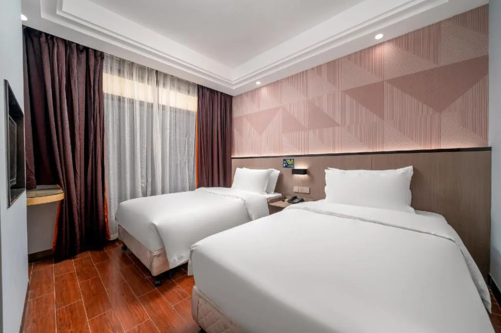 Bed in Borrman Hotel Guangzhou Xinshi Baixin Plaza Qifu Road