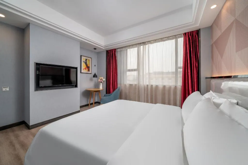 Bed in Borrman Hotel Guangzhou Xinshi Baixin Plaza Qifu Road