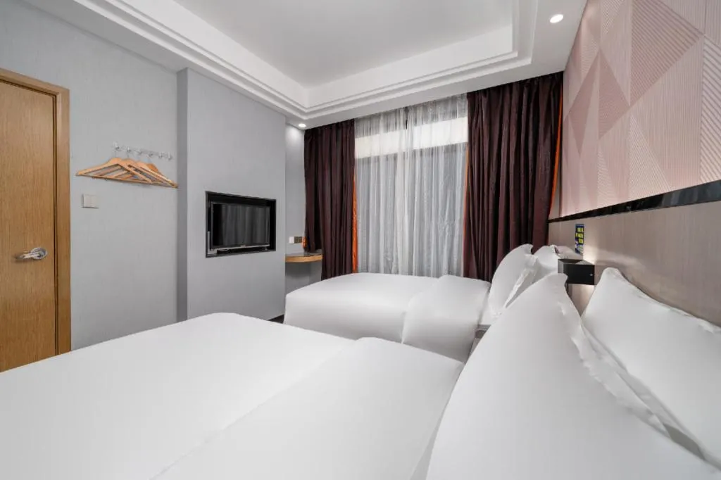 Bed in Borrman Hotel Guangzhou Xinshi Baixin Plaza Qifu Road
