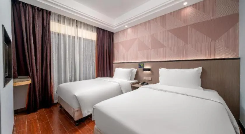 Bed in Borrman Hotel Guangzhou Xinshi Baixin Plaza Qifu Road