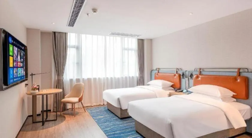 Bed in Echarm Hotel Guangzhou North Station Cultural Tourism City