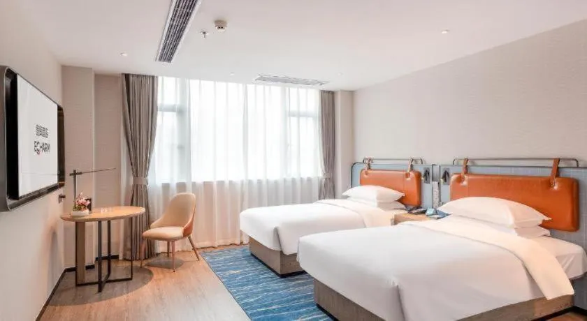 Bed in Echarm Hotel Guangzhou North Station Cultural Tourism City