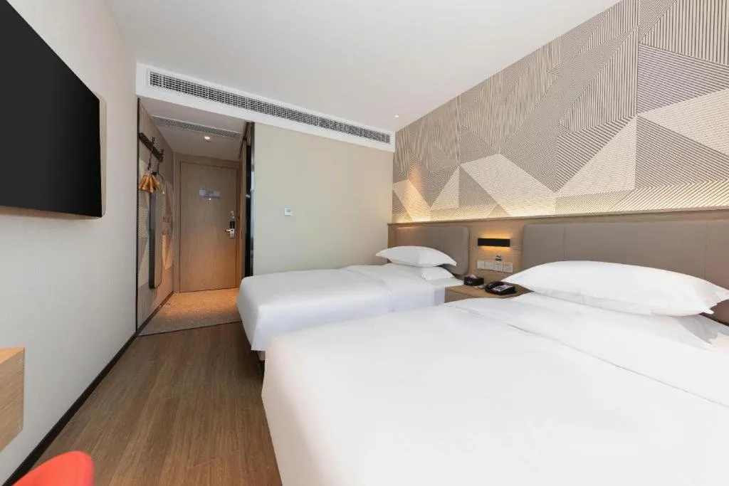 Bed in Borrman Hotel Wuhan First Hospital Hanzheng Street Metro Station