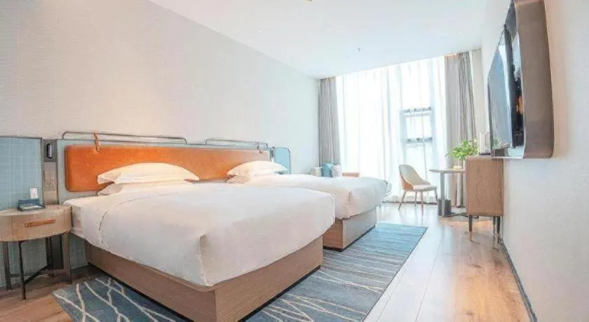 Bed in Echarm Hotel Zigong Machishui Wanda Plaza