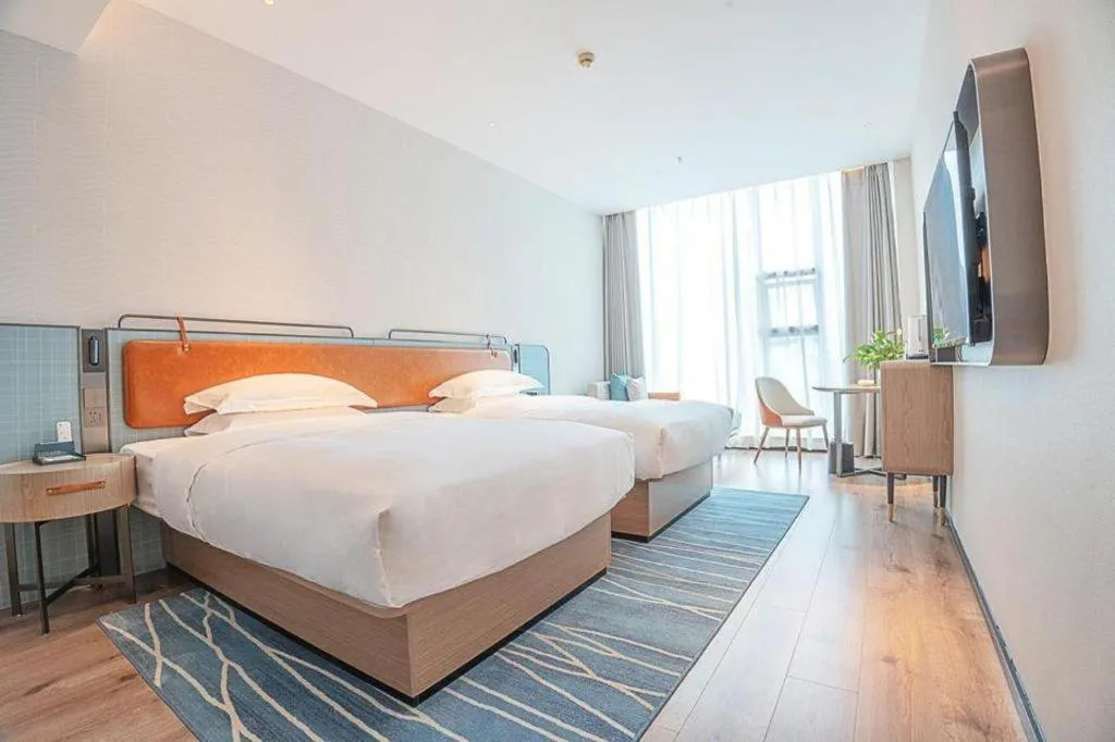 Bed in Echarm Hotel Zigong Machishui Wanda Plaza