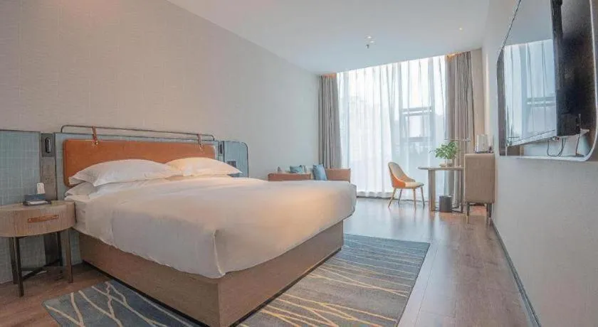 Bed in Echarm Hotel Zigong Machishui Wanda Plaza