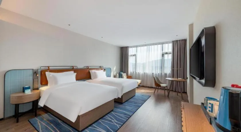 Bed in Echarm Hotel Zigong Machishui Wanda Plaza