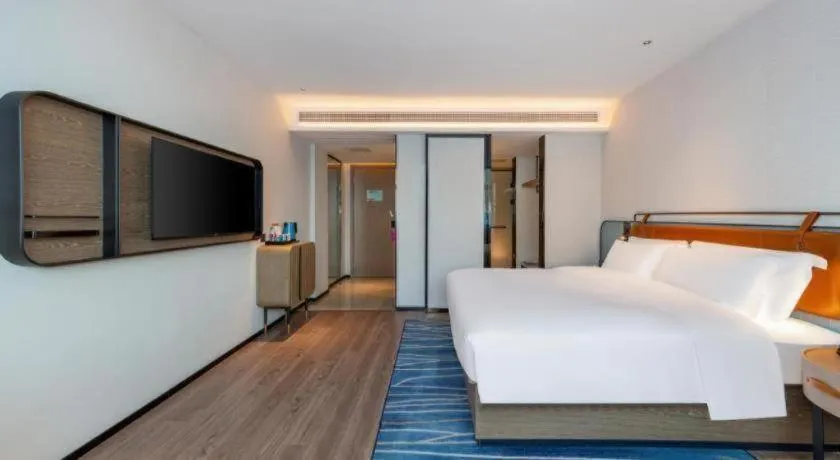 Bed in Echarm Hotel Zigong Machishui Wanda Plaza