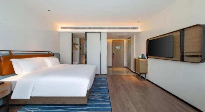 Bed in Echarm Hotel Zigong Machishui Wanda Plaza