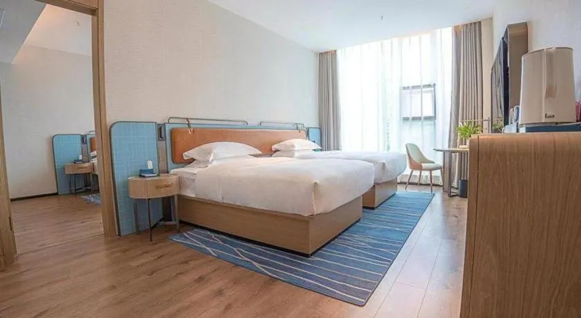 Bed in Echarm Hotel Zigong Machishui Wanda Plaza