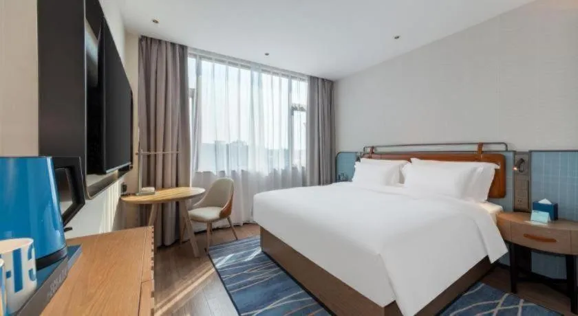 Bed in Echarm Hotel Zigong Machishui Wanda Plaza